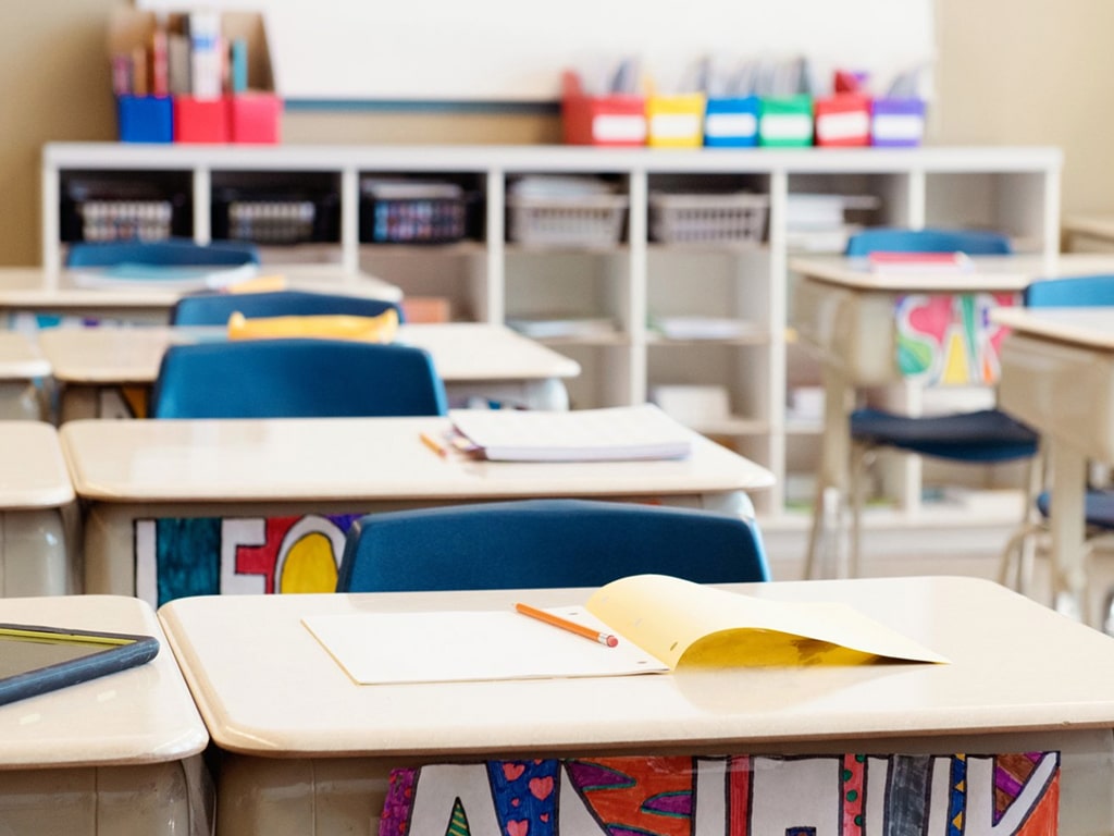 Book on a classroom desk.